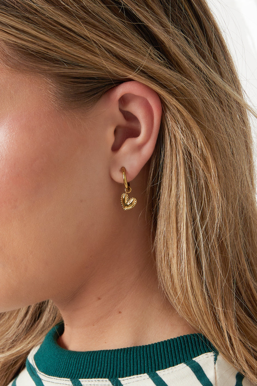 Detailed Dangling Heart Earrings · gold · model
